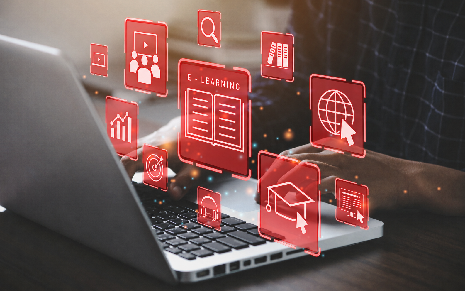 Laptop displaying an e-learning interface with icons representing online lessons, learning anytime, knowledge, audio, video, collaboration, goals, and certification.